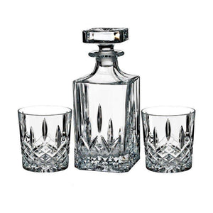 Crystal decanter and two glasses on a white background