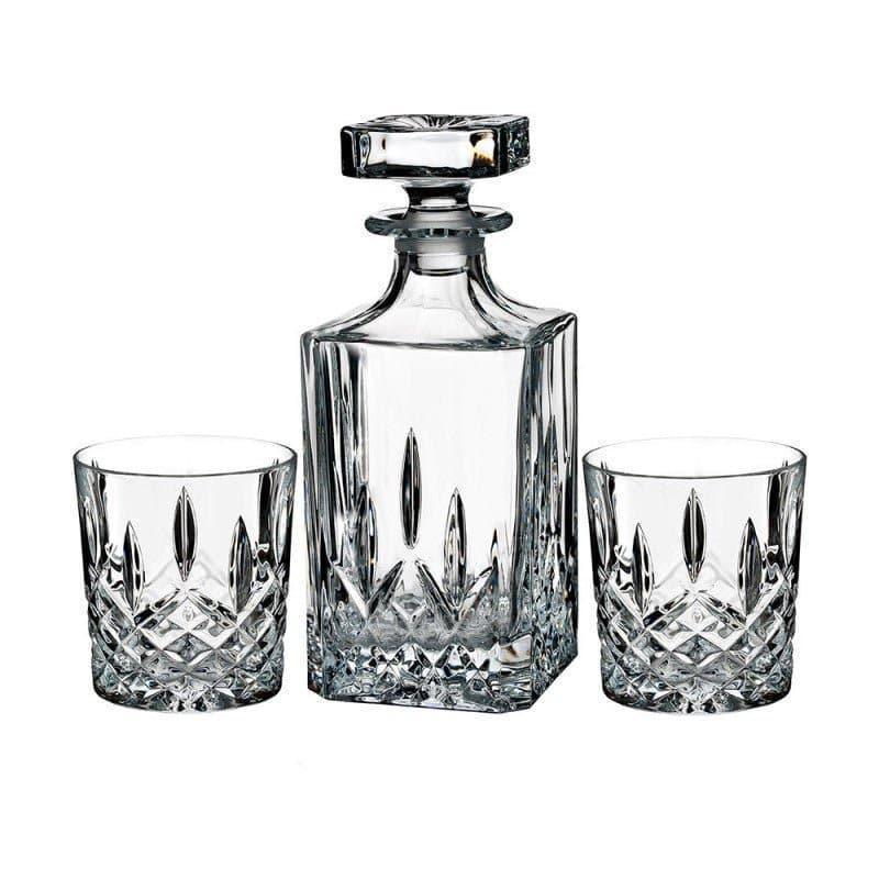 Crystal decanter and two glasses on a white background