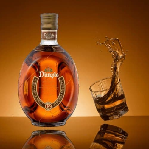 Dimple Whisky Bottle With a Glass